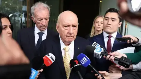 Indecent Assault Accusations Involving Prominent Down Under Broadcaster Reduced